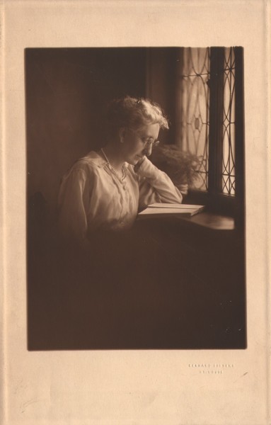 Woman reading by Studio Window