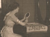 Woman seated at Dressing Table