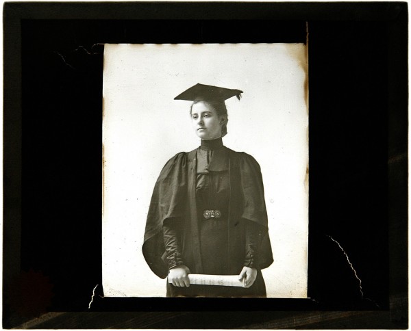Woman graduate holding Diploma