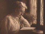 Woman reading by Studio Window