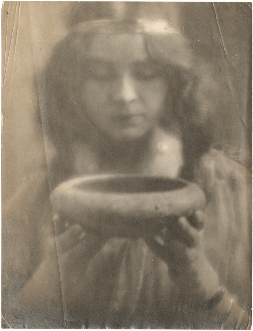 Portrait of Woman Holding up Bowl