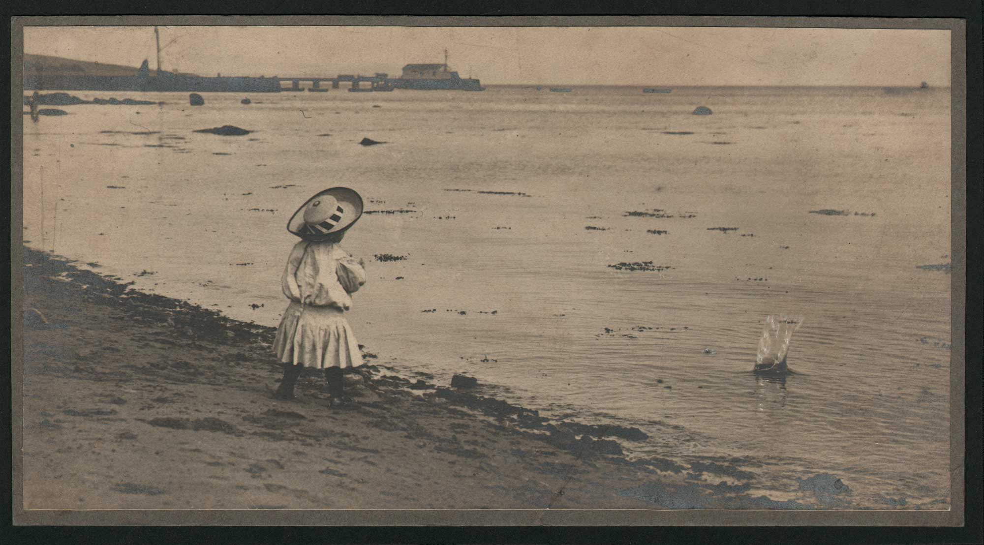 Girl Throwing Stone into the Sea