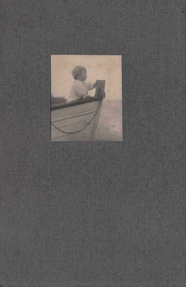 Dorothy Tucker holding onto Boat Prow