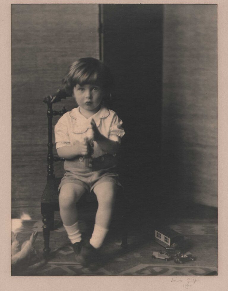 Child Playing with Toy Train