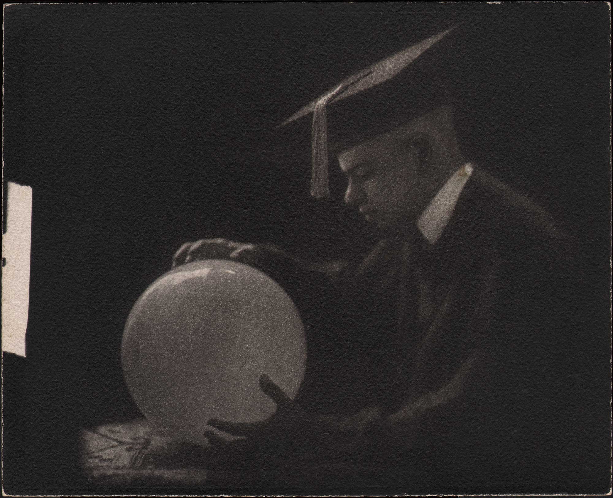 School Graduate Holding Globe