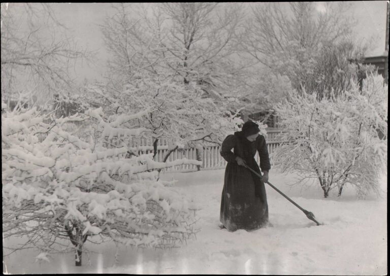 Minnie Fennel Sweeps Snow after Storm