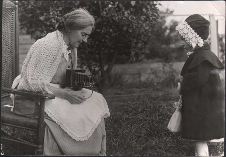 Jeanette Bernard Taking Photograph of Child