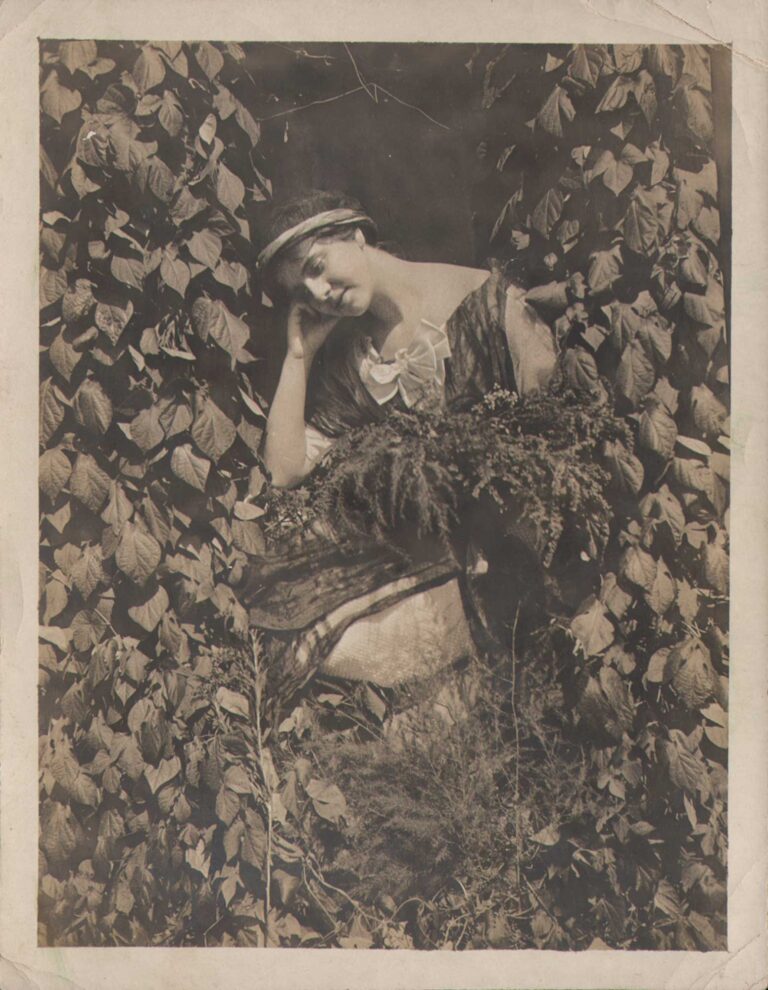 Contemplative Woman Surrounded by Plants