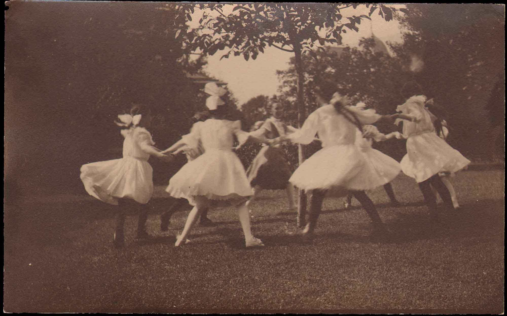 Girls Playing “Here We Go Round the Mulberry Bush”