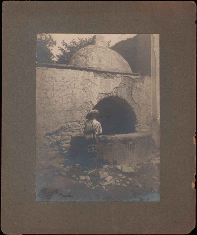 Man in Sombrero at Courtyard Cistern or Well